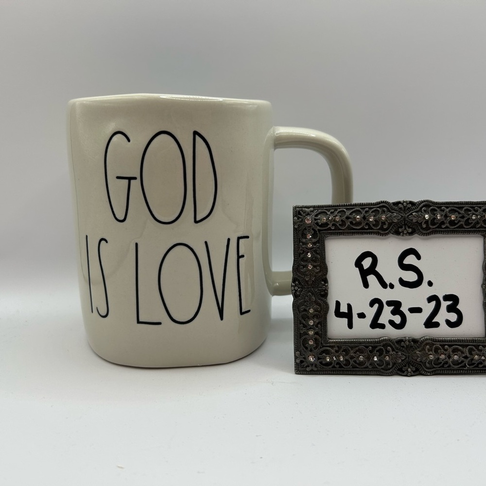 Rae Dunn “God is Love” mug with blue on the inside.